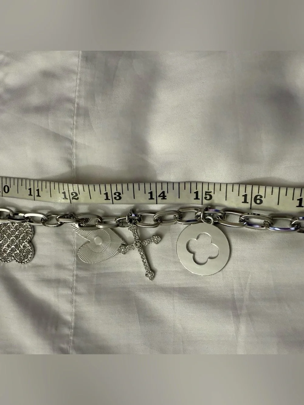 Silver tone metallic charms skinny chain belt